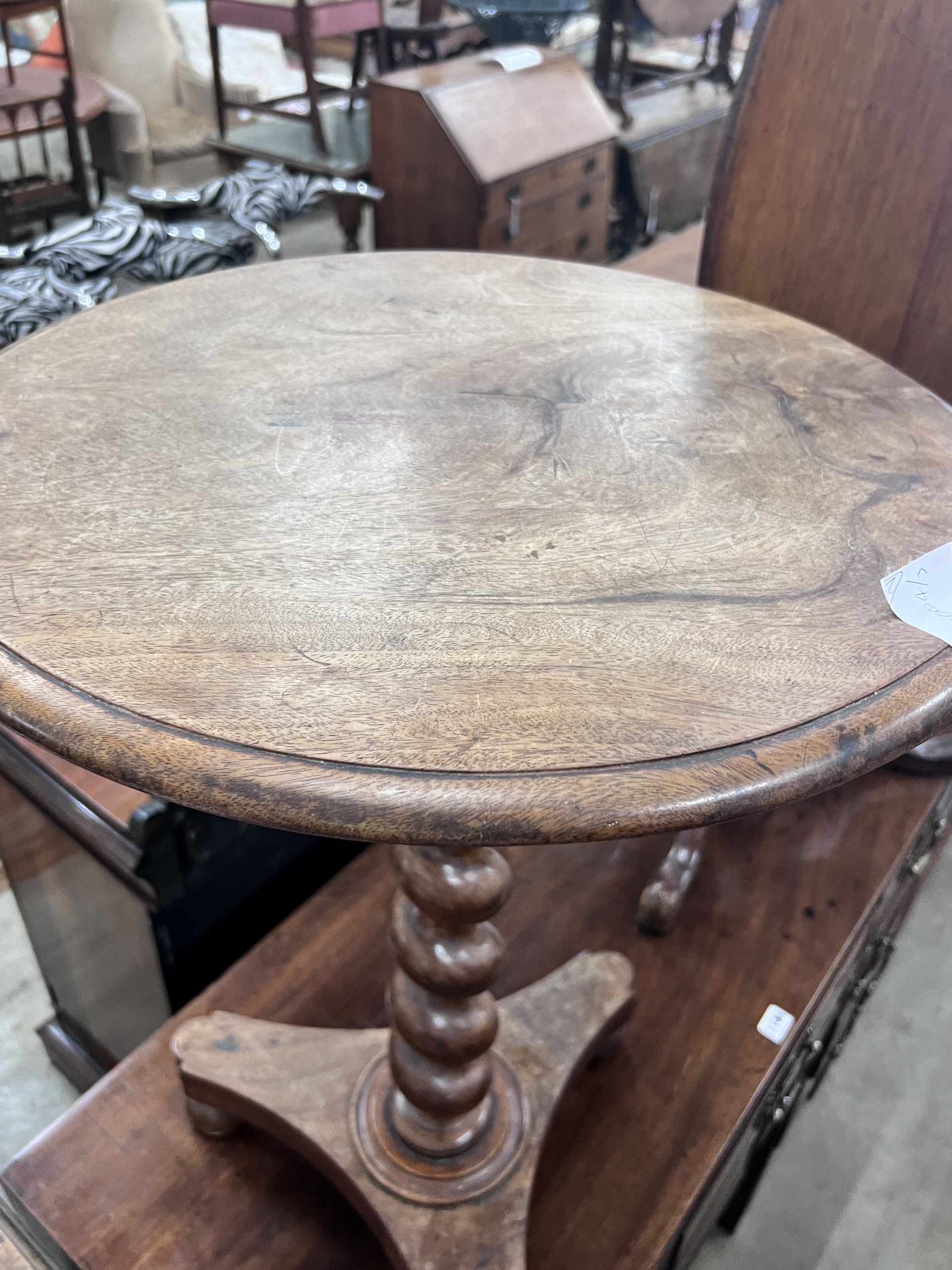 A Victorian spiral stem circular mahogany wine table, diameter 50cm, height 71cm, together with a Victorian oval mahogany tilt top tripod table